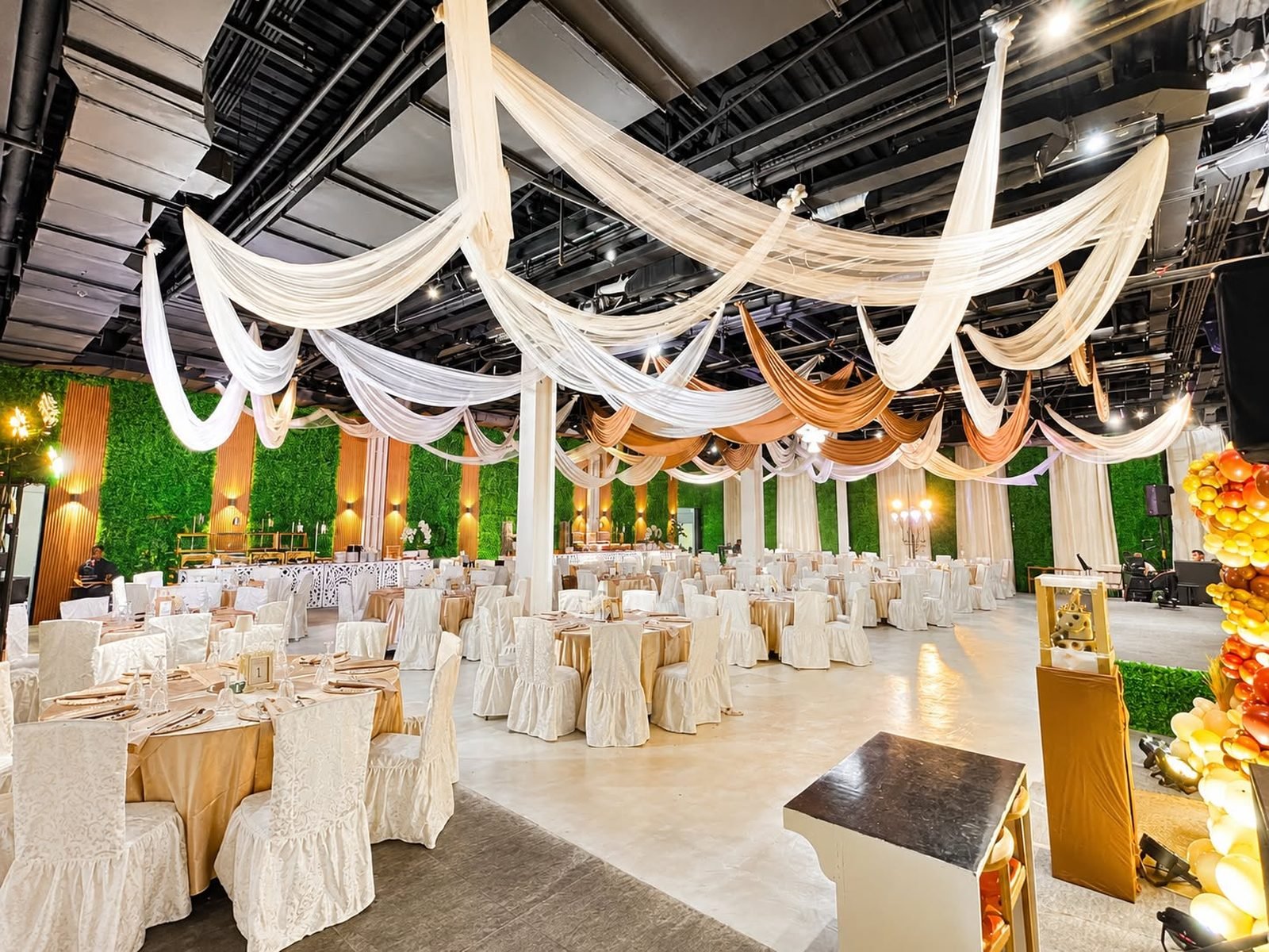 Round tables under the Pavillion's draped ceiling