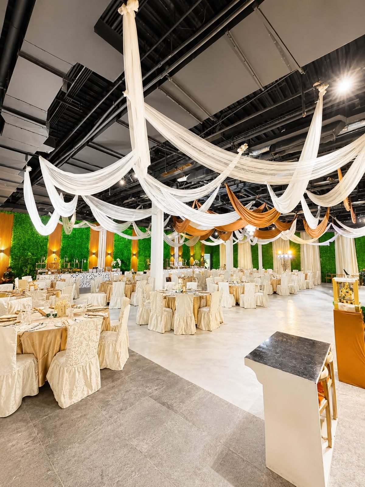Pavillion floor dressed in gold with the buffet line behind